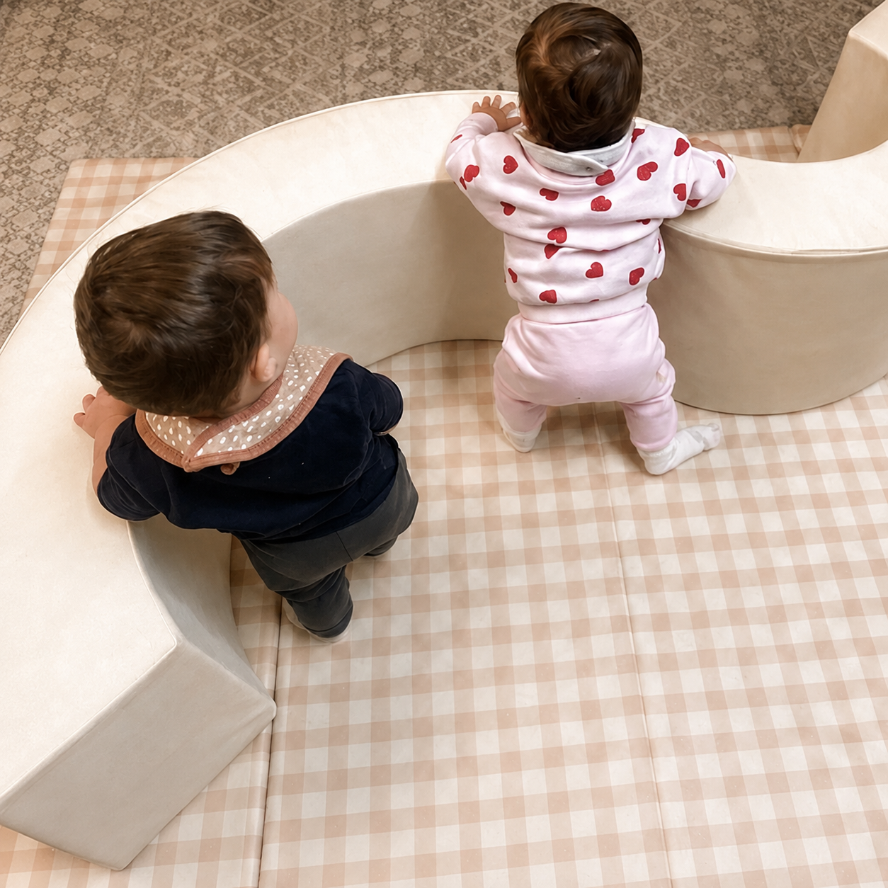 Babies developing movement and independence through soft play in the Koala Room